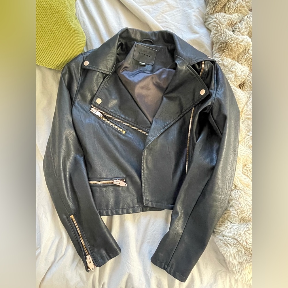 BlankNYC black leather jacket with gold accents